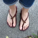 Barefoot sandals worn outdoors on pavement